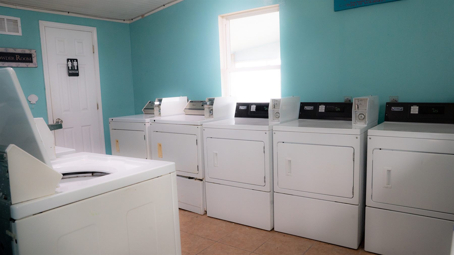 onsite laundry room with washers and dryers at Crystal Beach RV resort