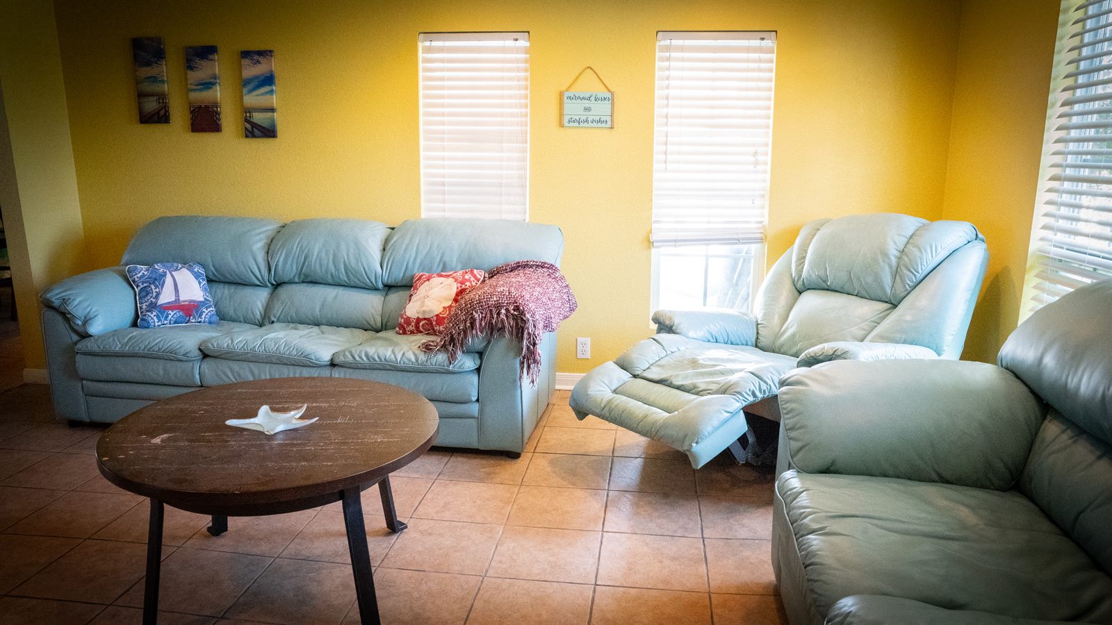living room seating inside the beach house rental at The Palms RV Resort